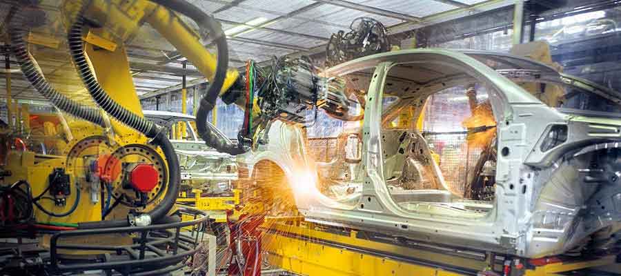 aluminum car chasis being assembled in automotive digitlal manufacturing factory