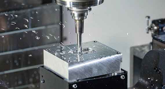 A Metal Block Milled in a CNC Machine