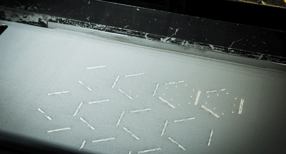 a laser fuses metal powder together in layers to farm a final part